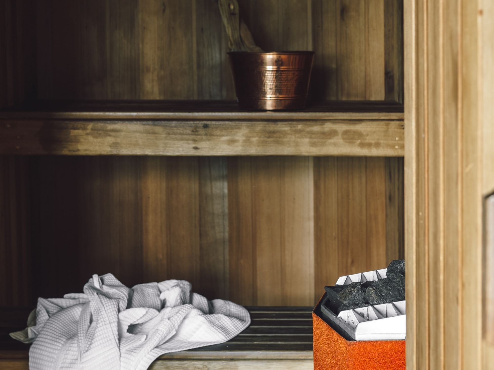 Towel & copper bucket in Pearl Penthouse Sauna, Como Melbourne