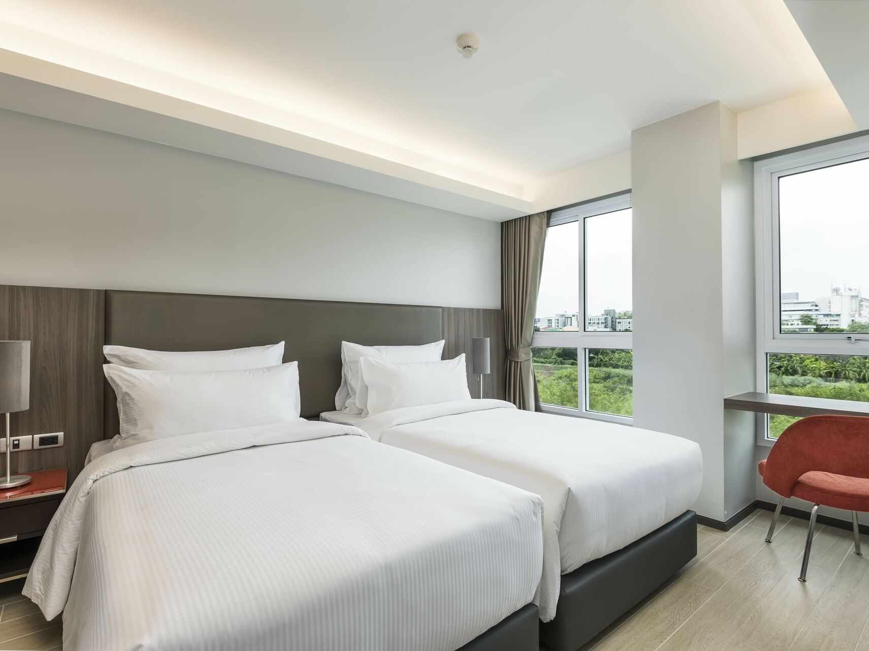 Twin beds in Grand 2-Bedroom Residence at Maitria Hotel Rama 9