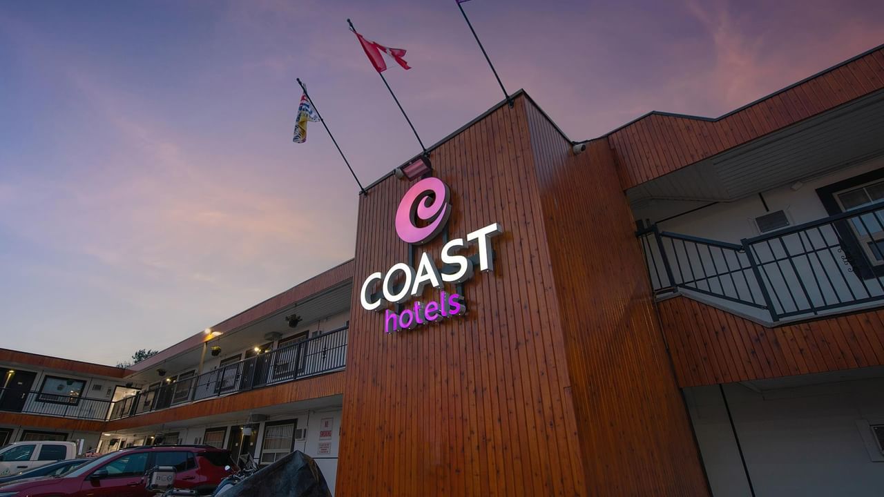 Exterior of Coast Dawson Creek Hotel at dusk