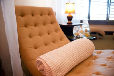 Closeup of towel on spa bed in Spa room at Chase on The Lake   