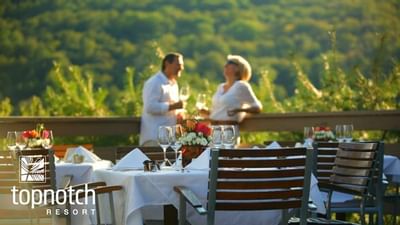 A couple dining outside at Topnotch Stowe Resort