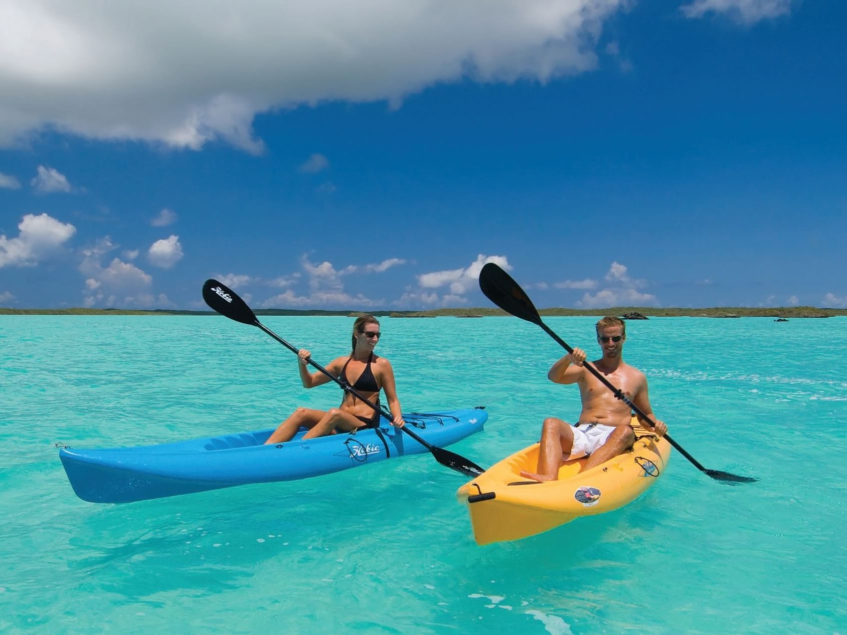 Couple Kayaking near Windsong Resort On The Reef