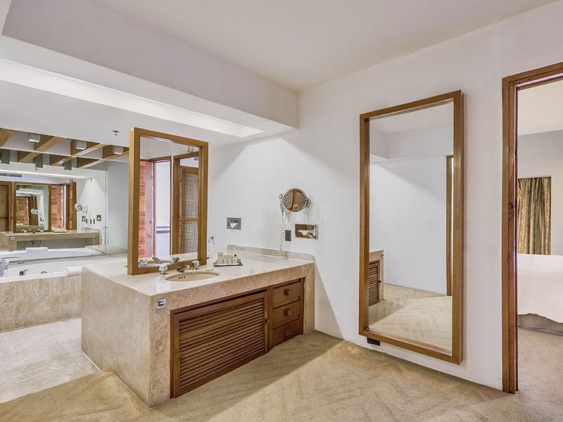 Bathroom vanity & bathtub in Presidential Suite at FA Hotels