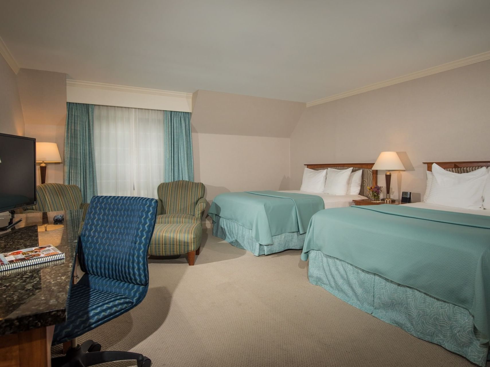 Workspace & lounge area in 2 Queen Beds Standard Accessible at Gorges Grant Hotel