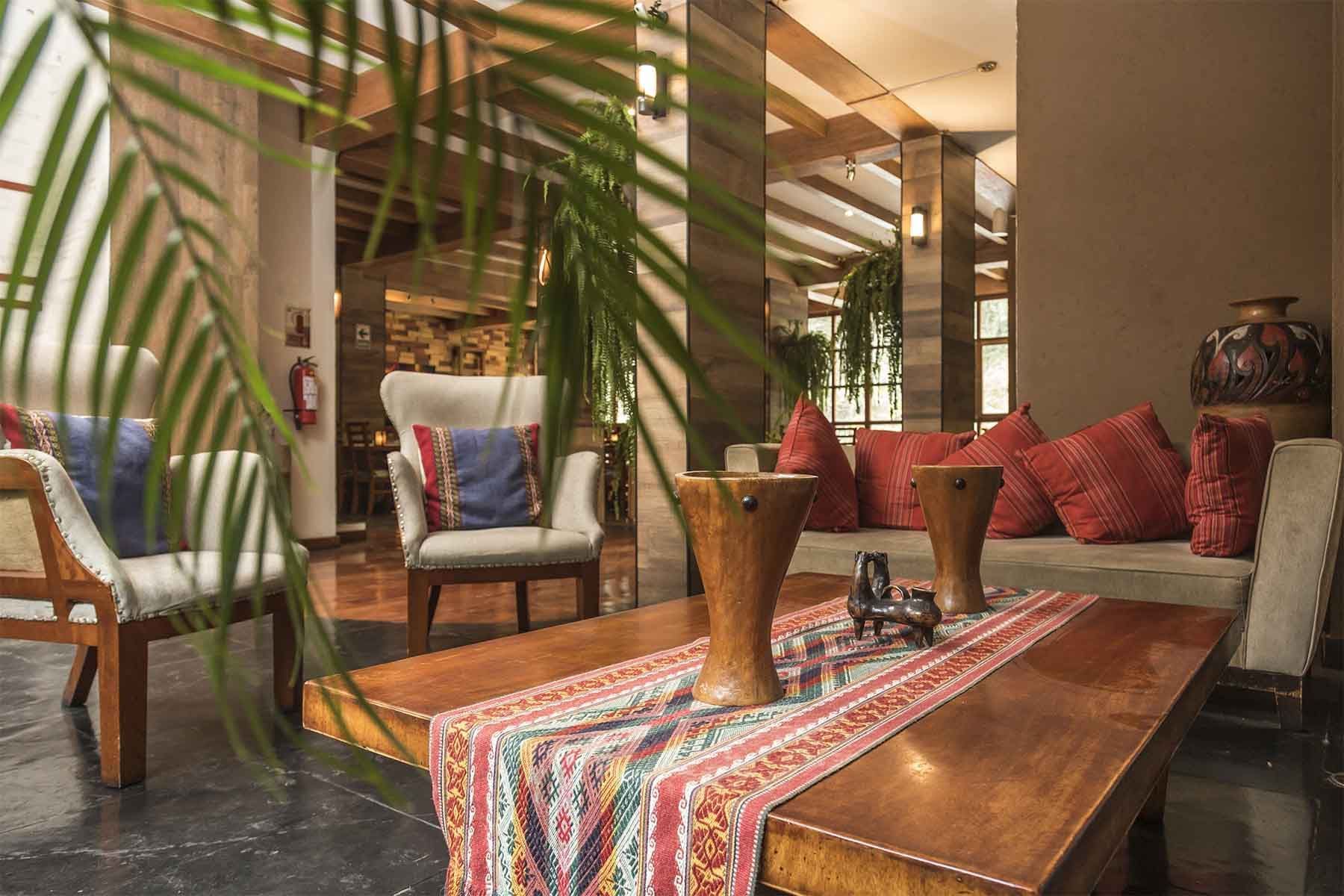 machu picchu hotel lobby with seating area and coffee table