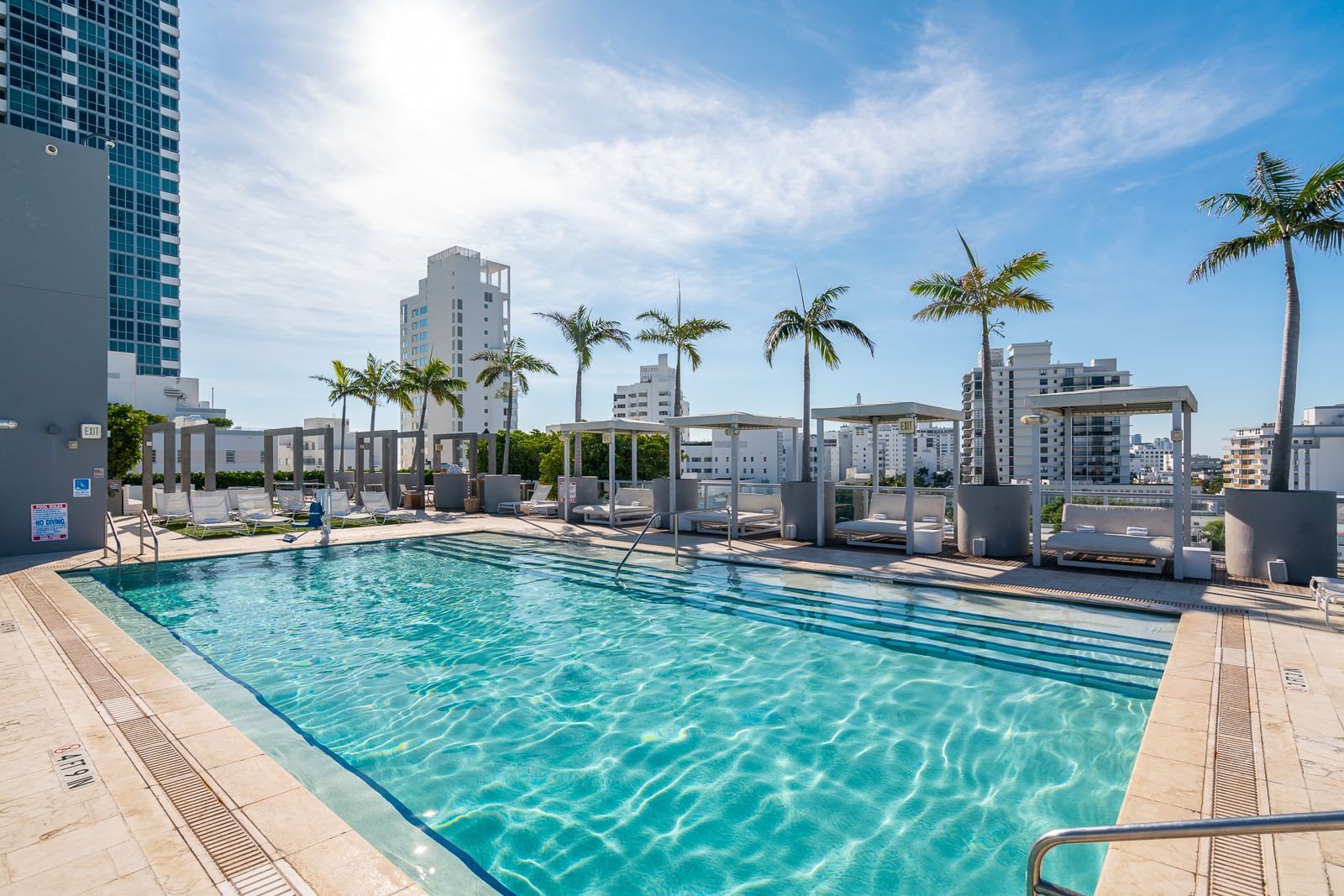 cabanas and lounge chairs at rooftop pool