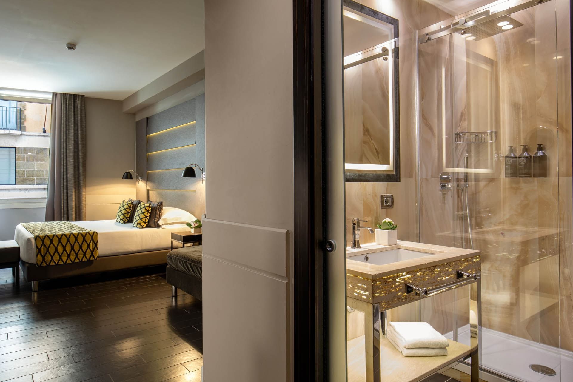 View of the Luxury marbled bathroom with a shower cubical in Deluxe Room at The Style