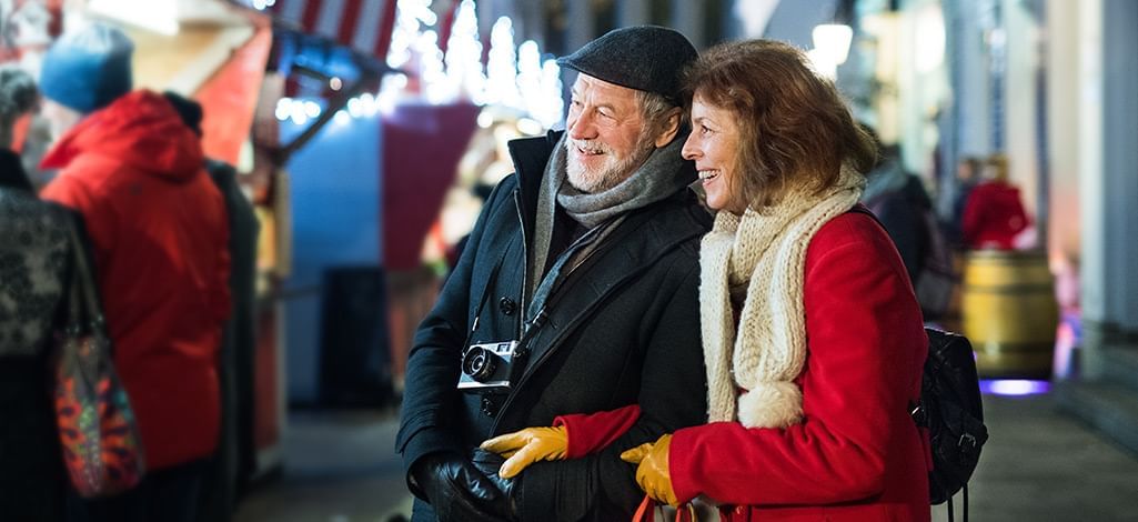 senior couple at a christmas market