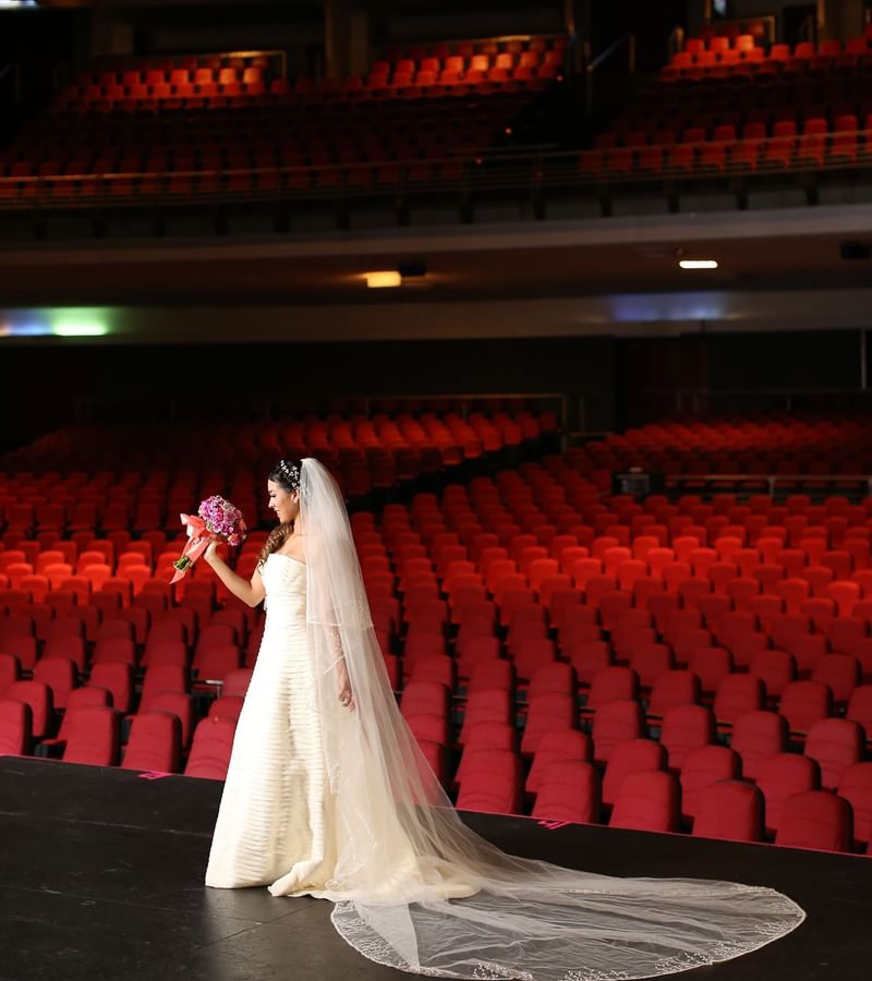 A bride on the stage at Forum Auditorium in Mundo Imperial