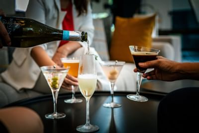 Bar tender serving cocktails at Carlton Hotel Bangkok Sukhumvit