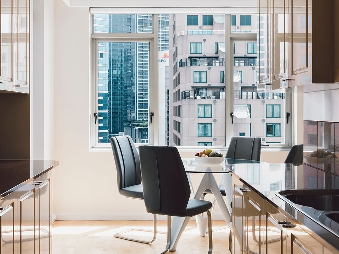Dining area with a city view in 2 Bedroom 2 Bathroom Premium Apartment at Quay West Suites Melbourne