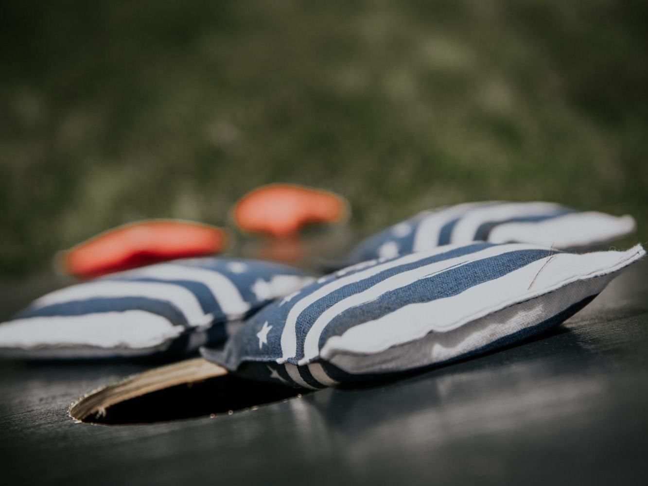 Close-up of cornhole game board & bean bags at Meadowmere Resort