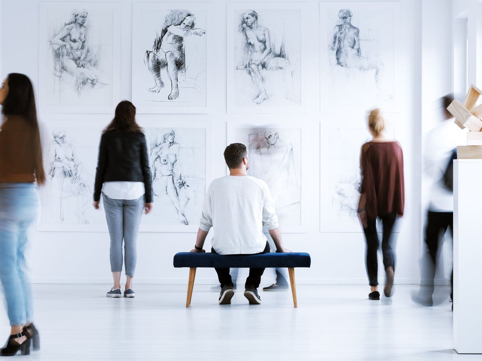 people observing art in a gallery