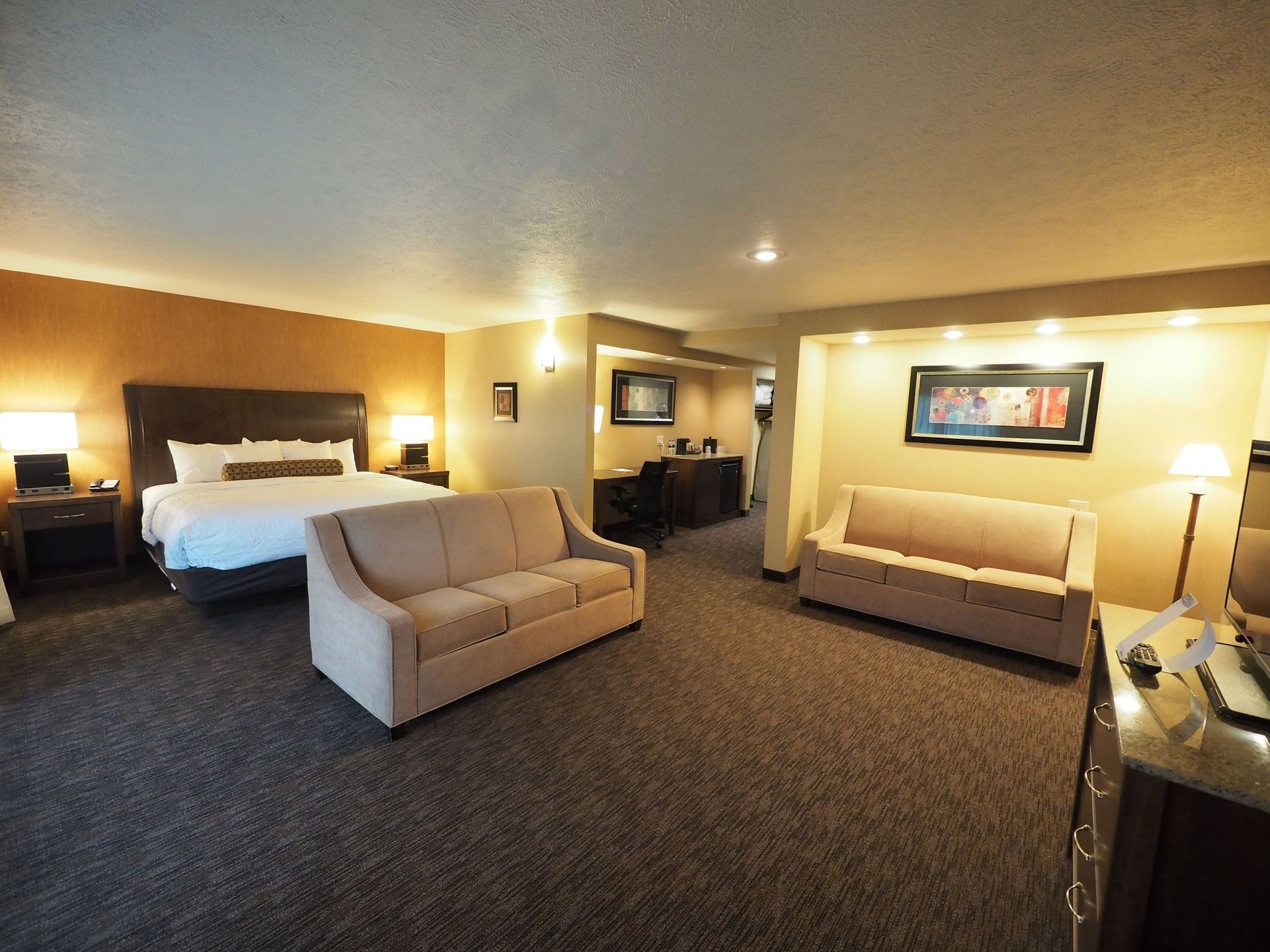 Junior Suite with king bed, 2 sofa beds and walkout at Evergreen Resort, Cadillac.