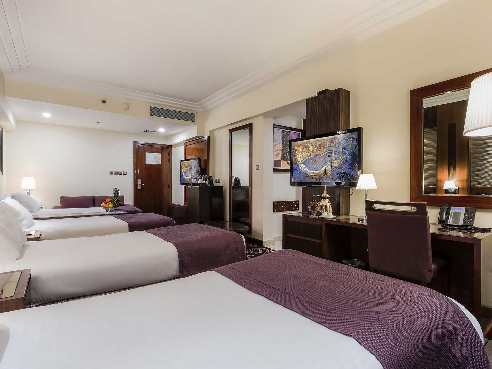 Beds & 2 TV's in Quadruple Room Haram view at Elaf Kinda Hotel