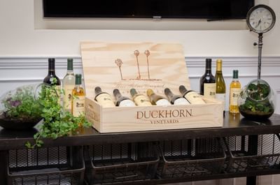 Box of Duckhorn wine bottles showcasing a variety of flavors neatly packed at The Stanley Hotel