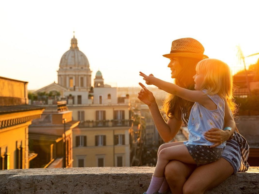 Mother & her daughter enjoying the cityscape view near Bettoja Hotel Mediterraneo