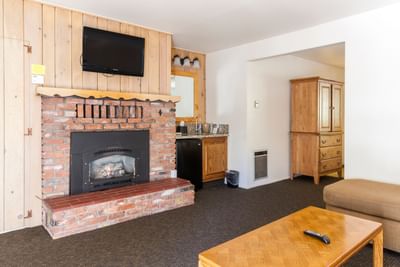 Room with fireplace and coffee table at Alpenhof Lodge