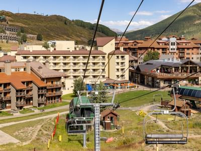 Aerial view of Elevation Resort & Spa with ski lift and mountain backdrop at Elevation Resort and Spa.