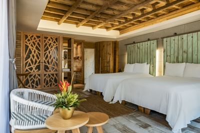 Master Suite Double Room with 2 twin beds & sitting area at Hotel Isla Del Encanto