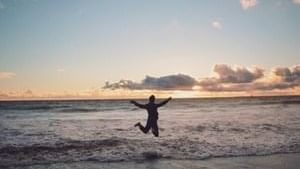 Person enjoying Manly Beach near Sebel Quay West Suites Sydney