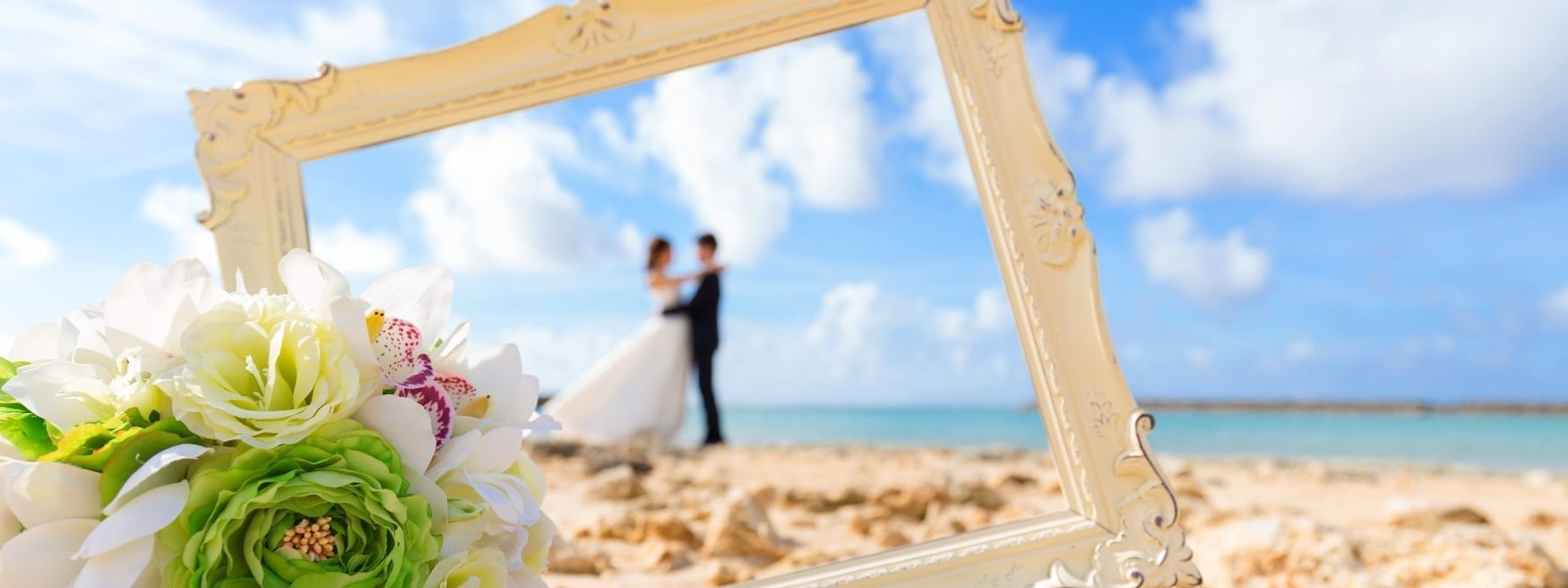 Couple having a photoshoot on beach at Daydream Island Resort