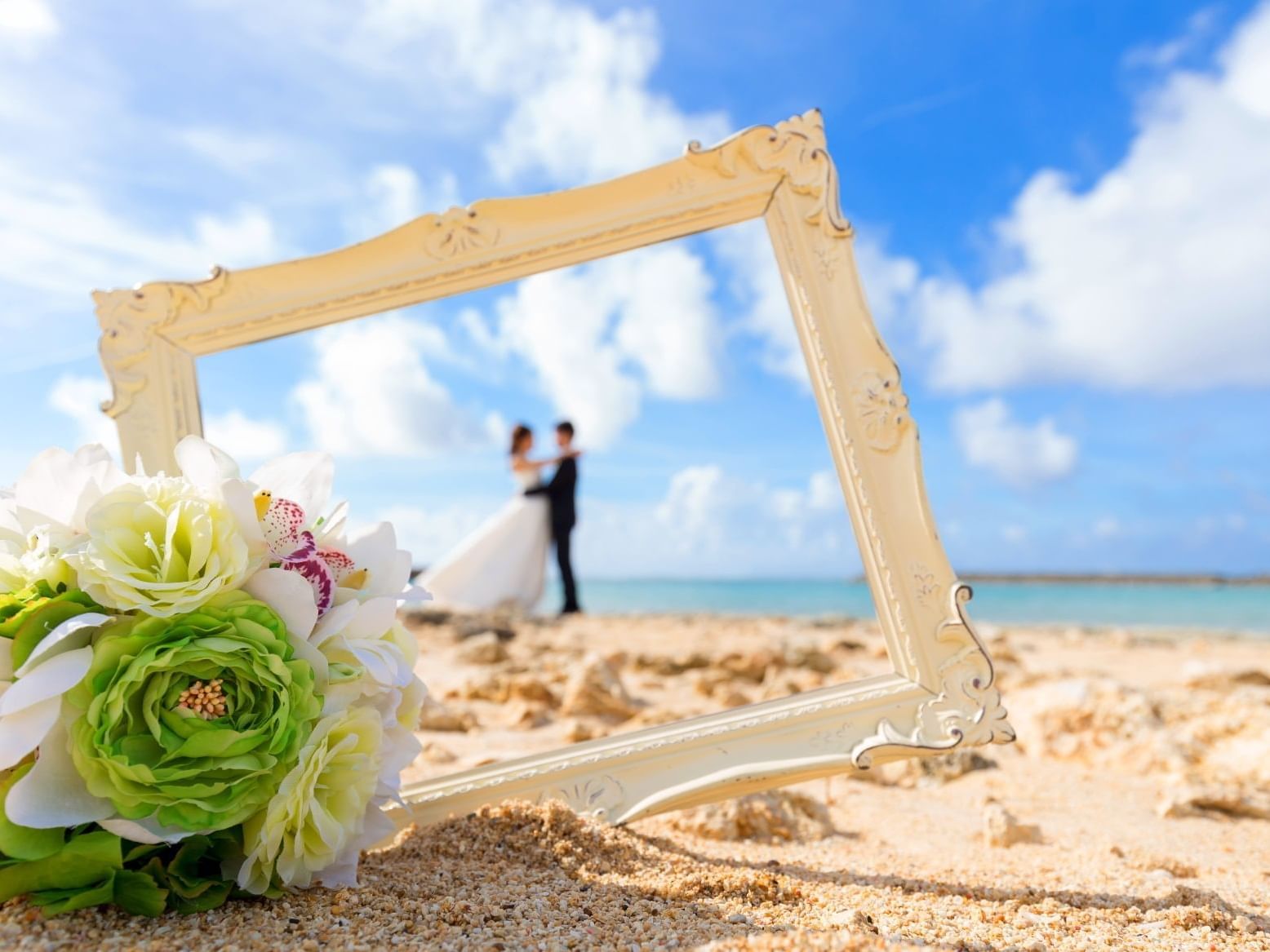 Couple having a photoshoot on beach at Daydream Island Resort