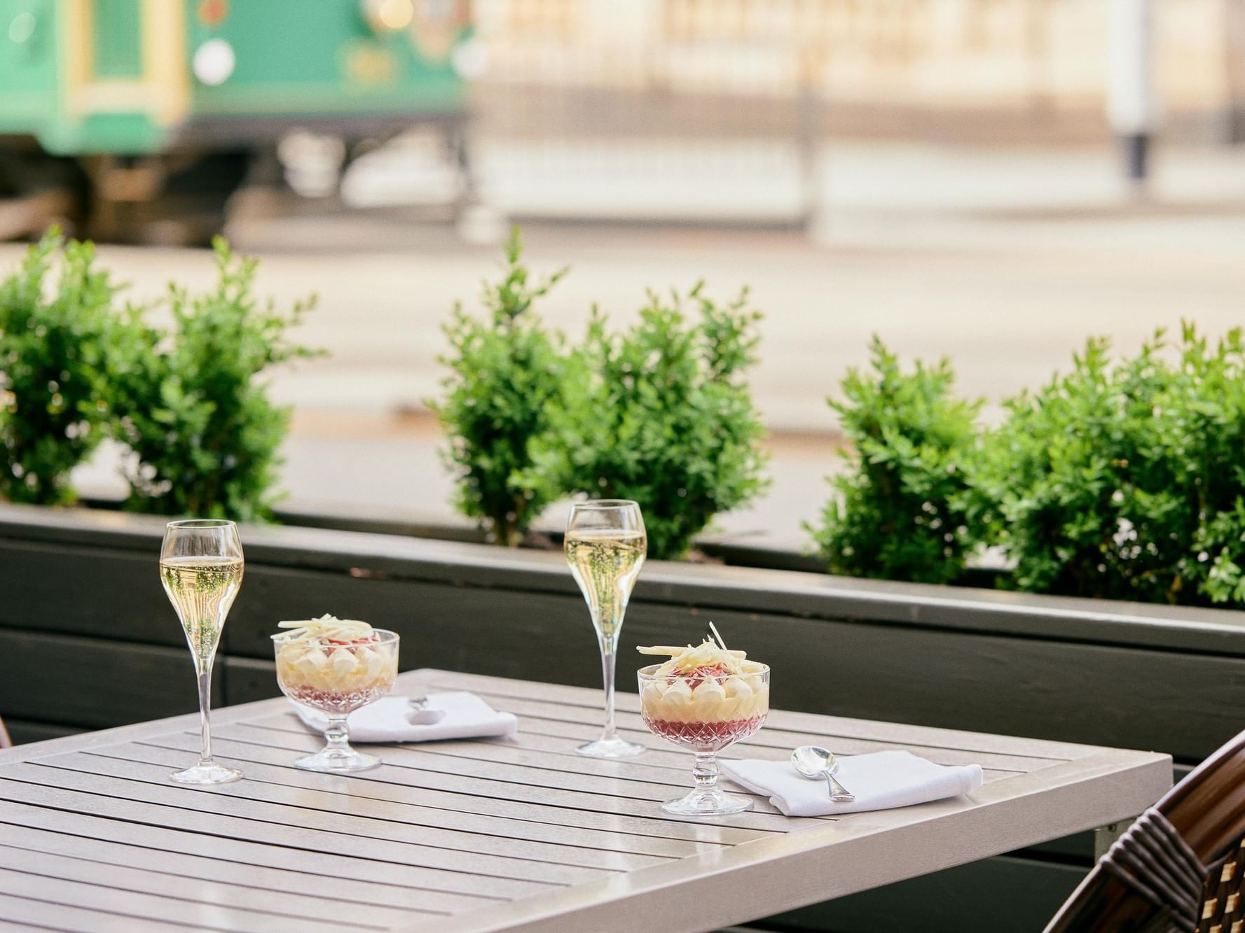 Outdoor dining of two trifles on a table at The Cricketers Bar, The Windsor Melbourne