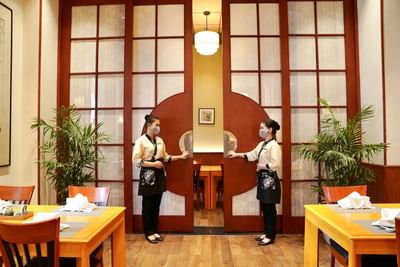 Waitresses by the Restaurant entrance at Hanoi Daewoo Hotel