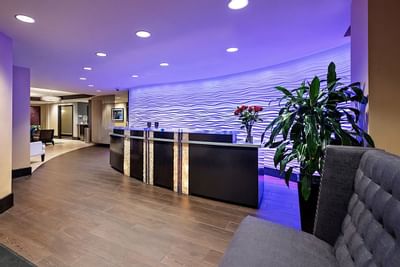 Front desk area with seating arrangements at Artmore Hotel