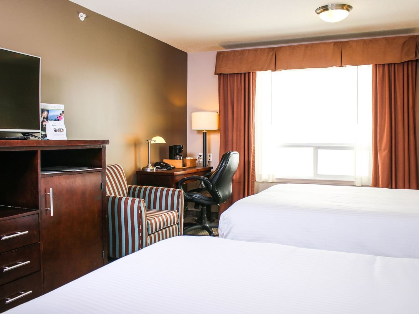 Two beds with TV in Two Queen Bedroom at Stoney Nakoda Resort