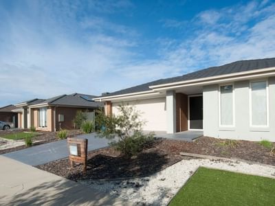A row of modern houses with solar panels and a car parked in Shepparton.