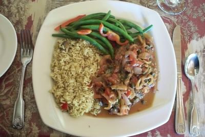 Chicken piccata entree with rice and green beans