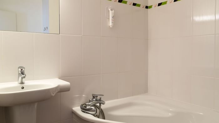 Bathroom vanity in bedrooms at Hotel du Chateau