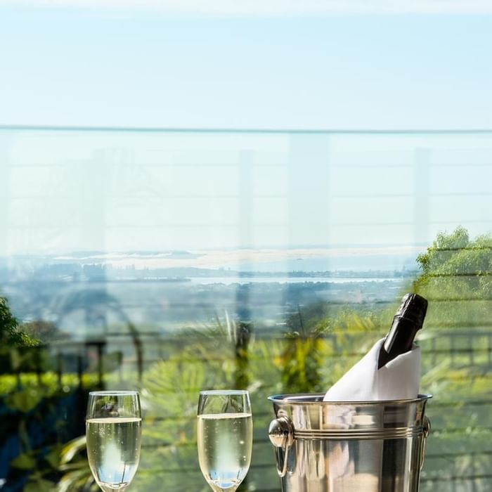 Champagne on ice and glasses served outdoors with a distant city view at Mercure Charlestown