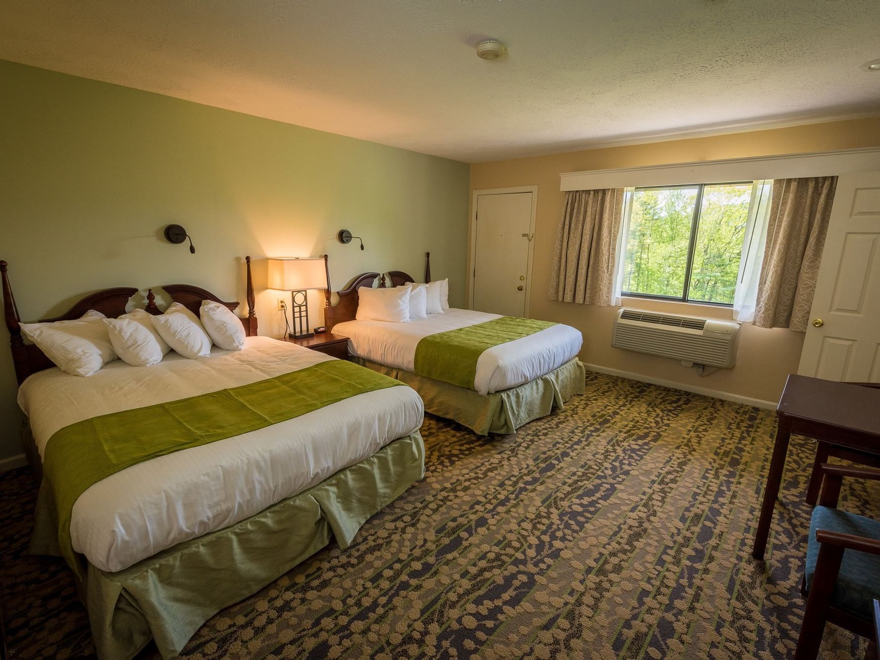 Two queen beds with mountain views in a room at Fox Ridge Resort in Conway.
