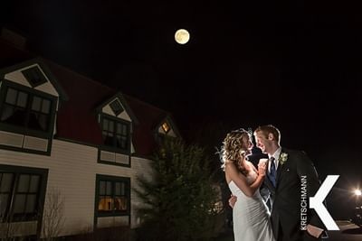 Newly married couple outside under the moon