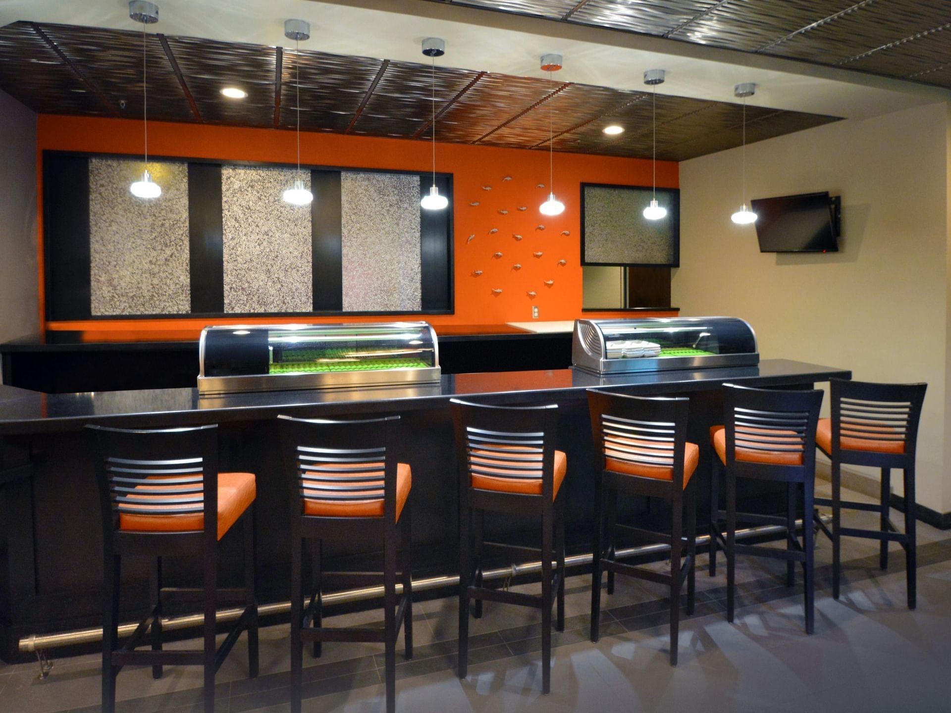 Stools by the counter in Shogun Sakura Sushi at Rosen Inn Universal