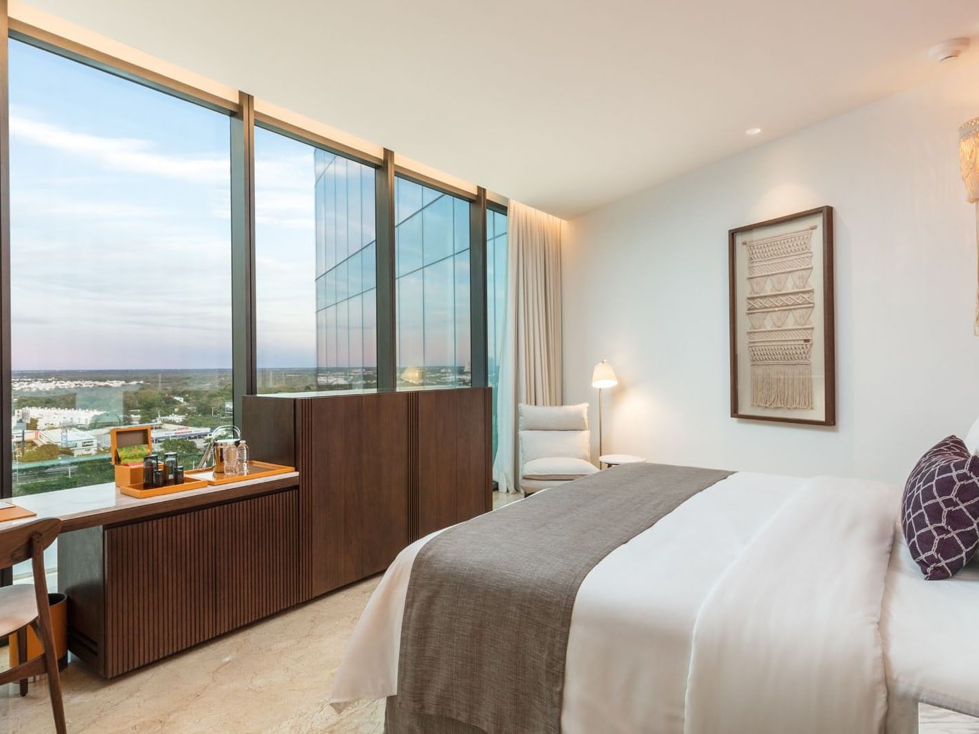 King Camino Real Club with a refreshment station, marble floors, and glass walls facing the city at Camino Real Merida