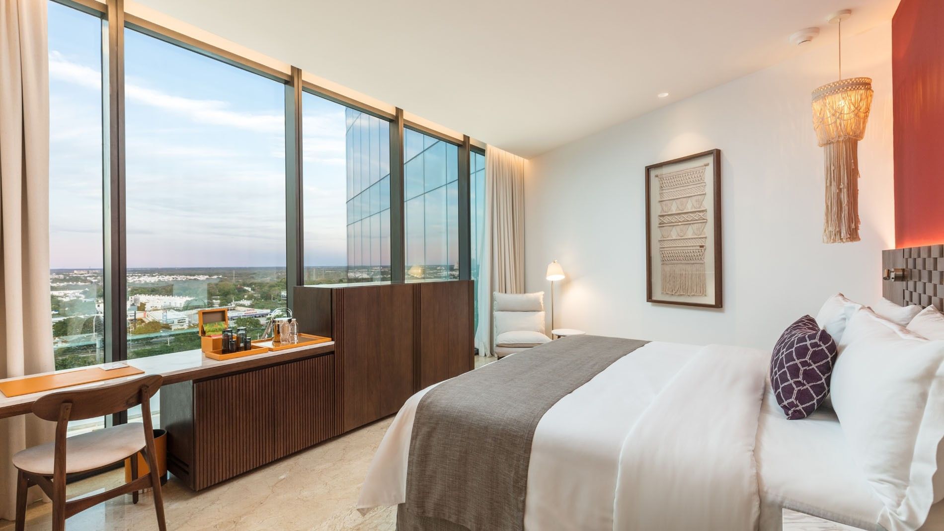 King Camino Real Club with a refreshment station, marble floors, and glass walls facing the city at Camino Real Merida