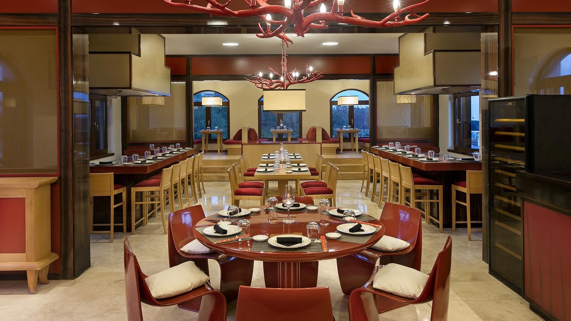 Round and long dining tables arranged in Sakura Asian Restaurant at Titanic Mardan Palace