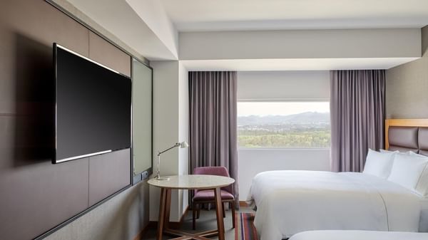 Beds & TV in Deluxe Room 2 Double at FA Hotels & Resorts