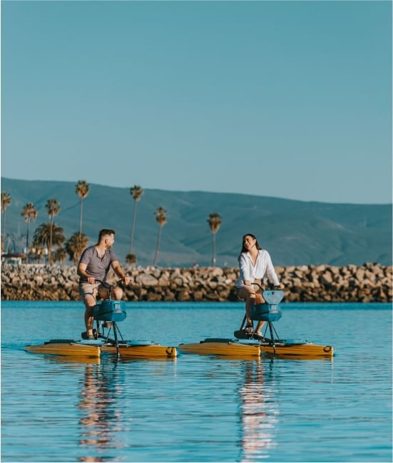 Couple engaged in water sports at Hotel Coral y Marina