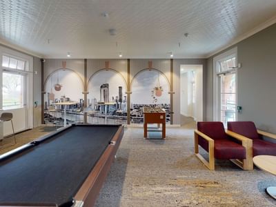 Games room with pool table, air hockey and seating at UniLodge Herston.
