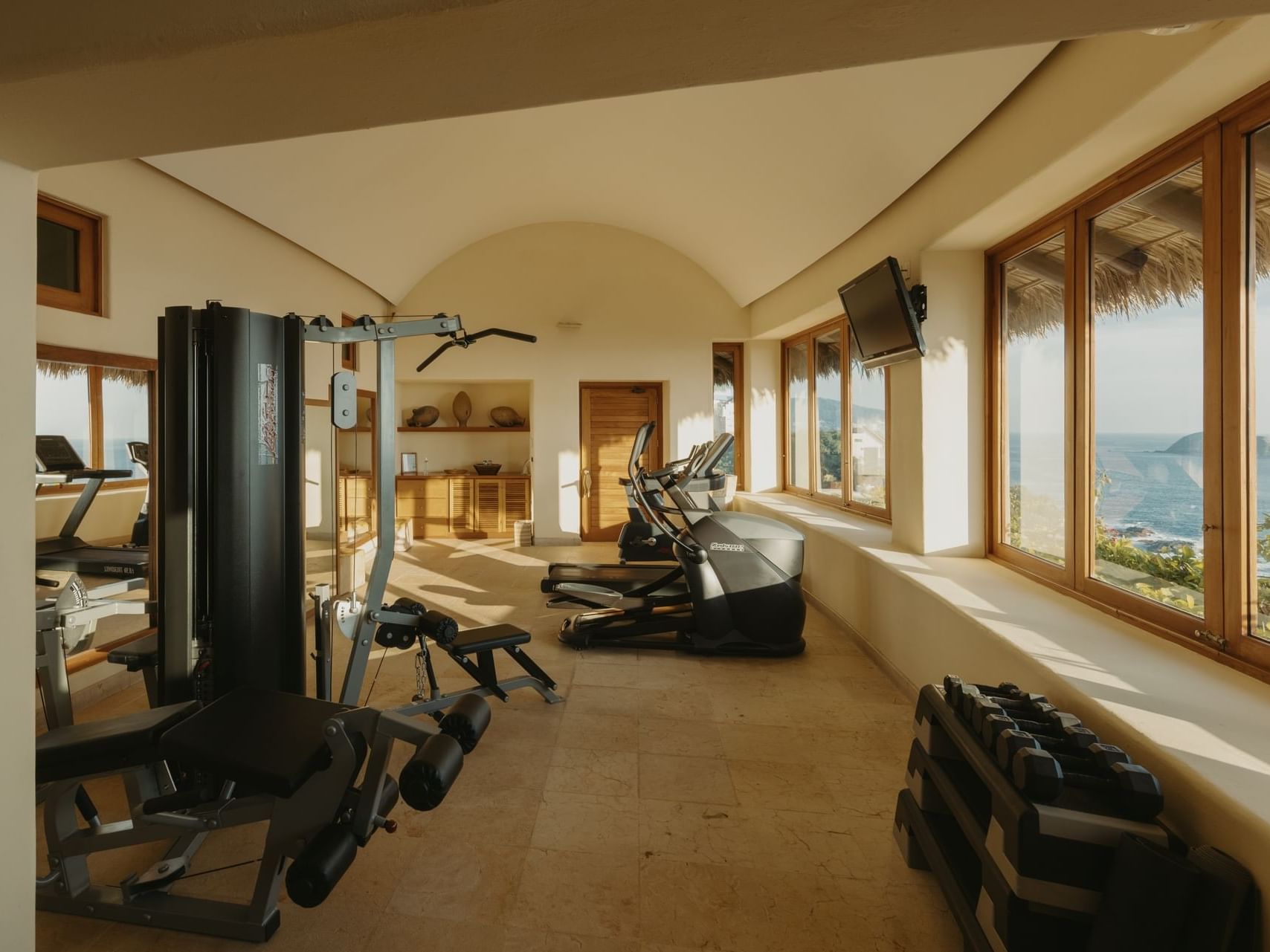Fully equipped gymnasium with outdoor view, Cala de Mar Resort