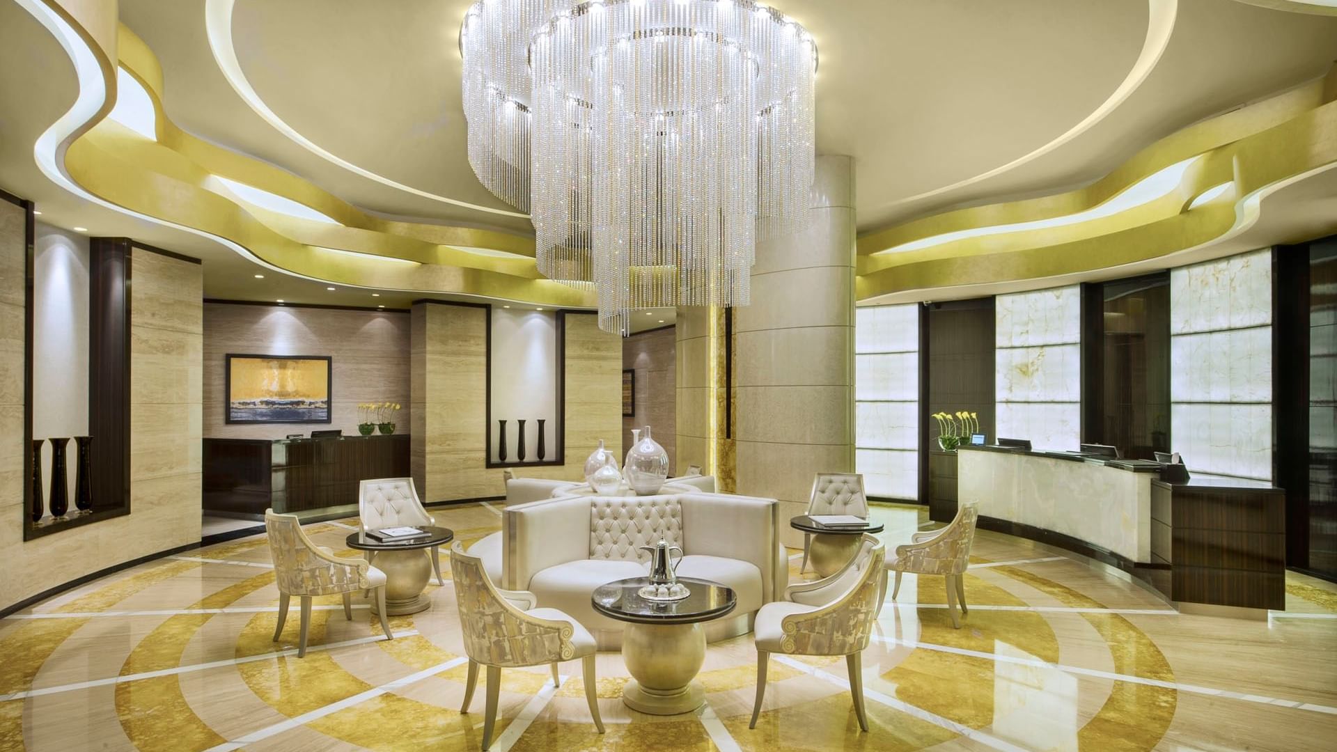 Lobby area with modern decor & warm abience featuring front desk at DAMAC Maison Cour Jardin