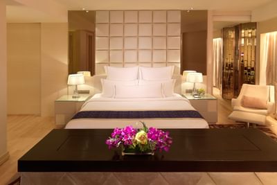 Modern interior featuring a bed in Executive Suite with wooden floors, A One World Hotel room