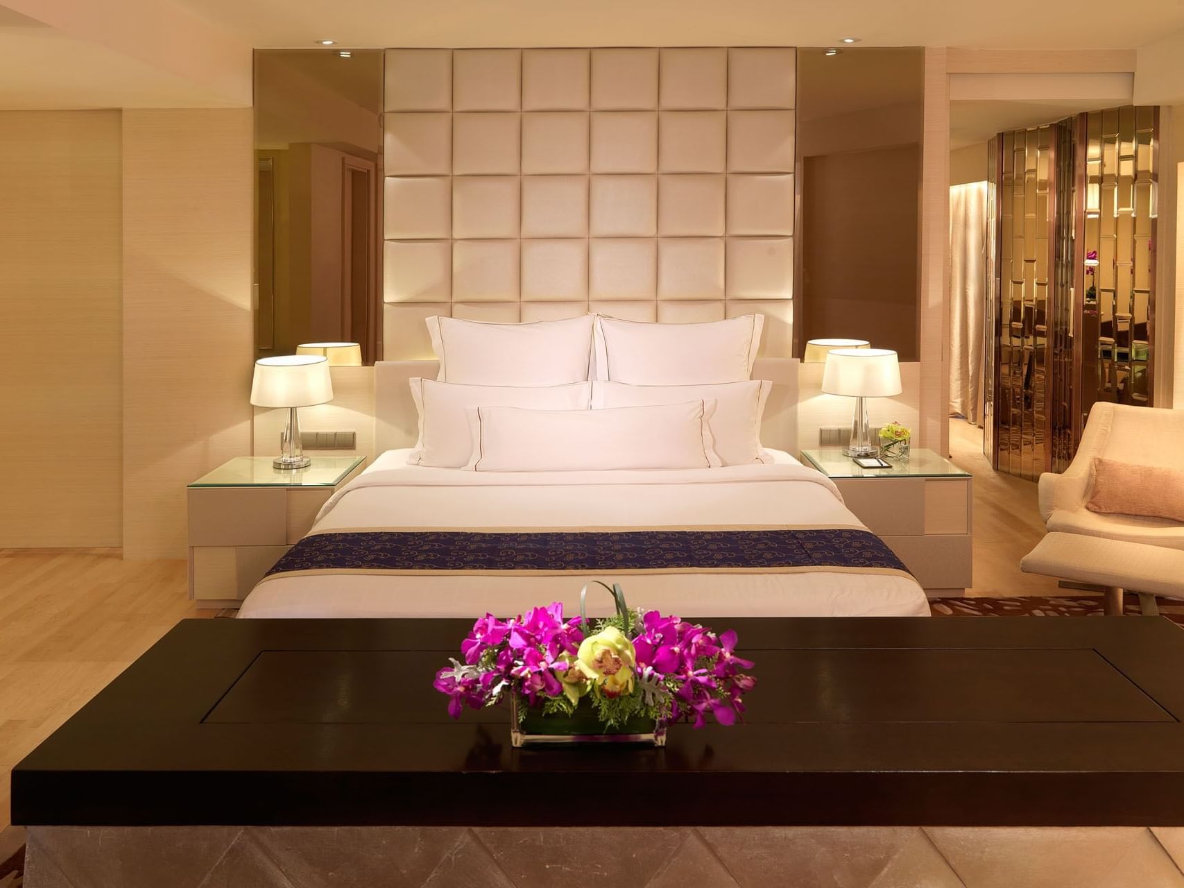 Modern interior featuring a bed in Executive Suite with wooden floors, A One World Hotel room