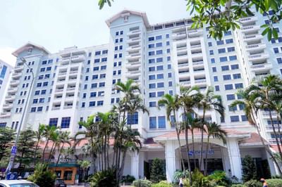 Exterior view of the Hanoi Daewoo Hotel with garden area
