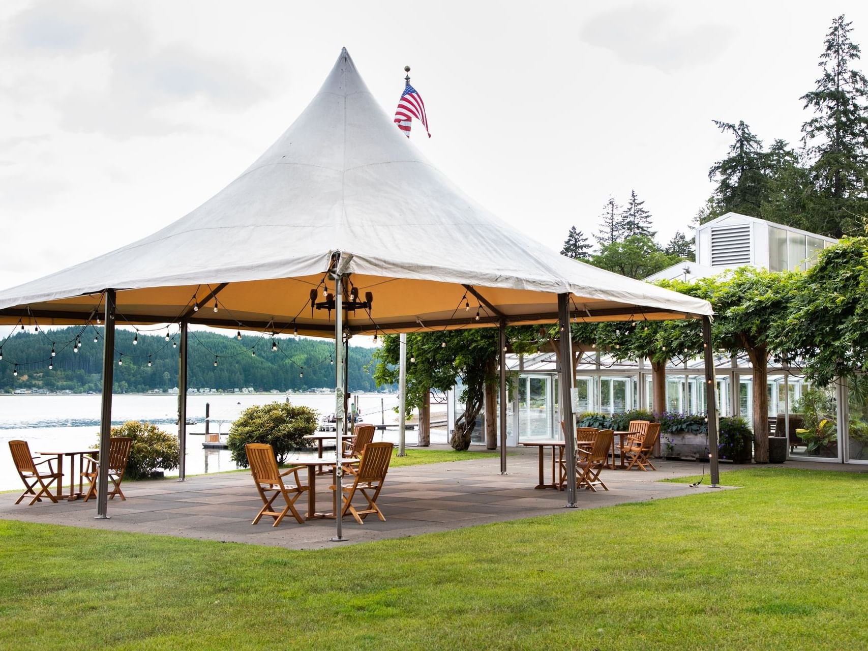 Waterfront Checkerboard's outdoor patio on the ground overlooking the canal at Alderbrook Resort & Spa